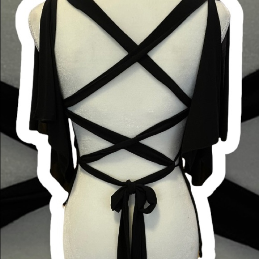 Cute open backed black bat wing blouse. Size medium.